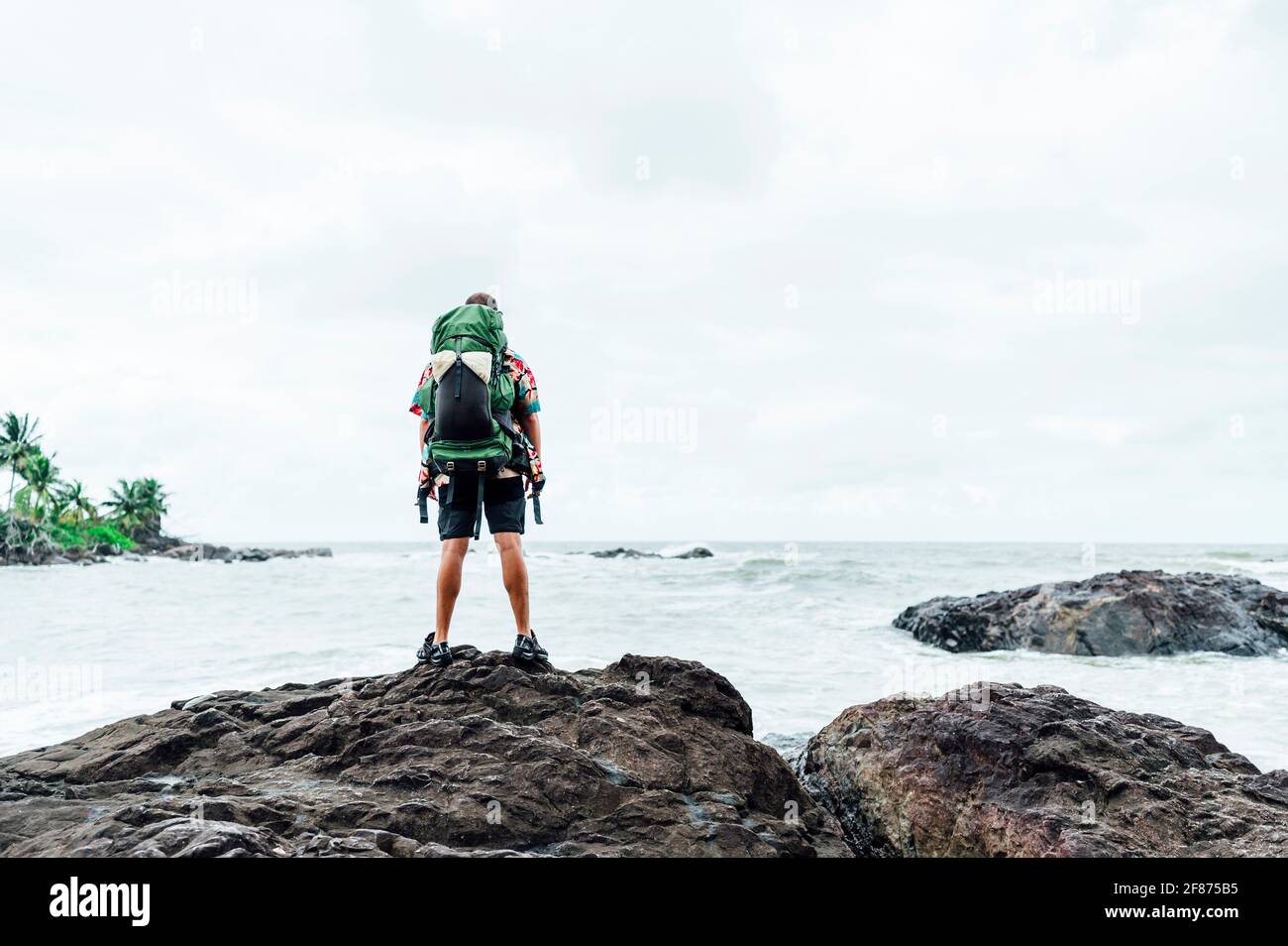 Digital nomad man on the beach Stock Photo - Alamy