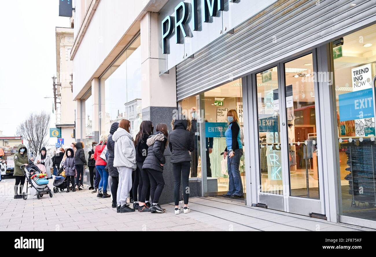 Brighton, UK. 12th Apr, 2021. Staff at the Primark store in Western Road Brighton welcome back customers early this morning as the next stage of lockdown easing begins in England : Credit: Simon Dack/Alamy Live News Stock Photo