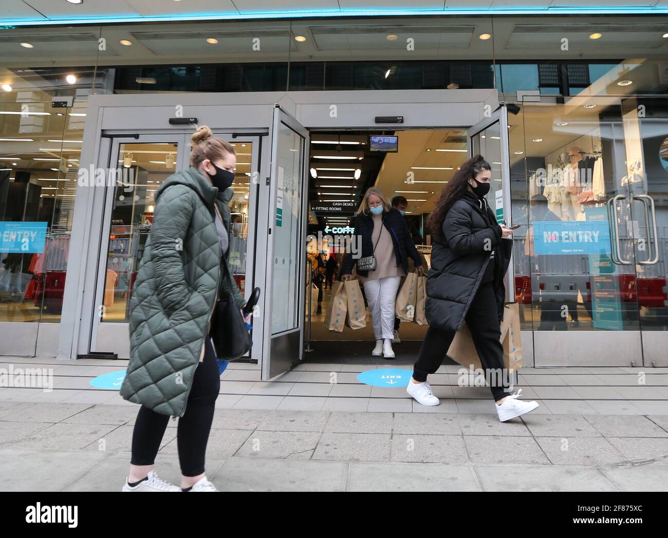 London, England, UK. 12th Apr, 2021. Shoppers are seen carrying bags on