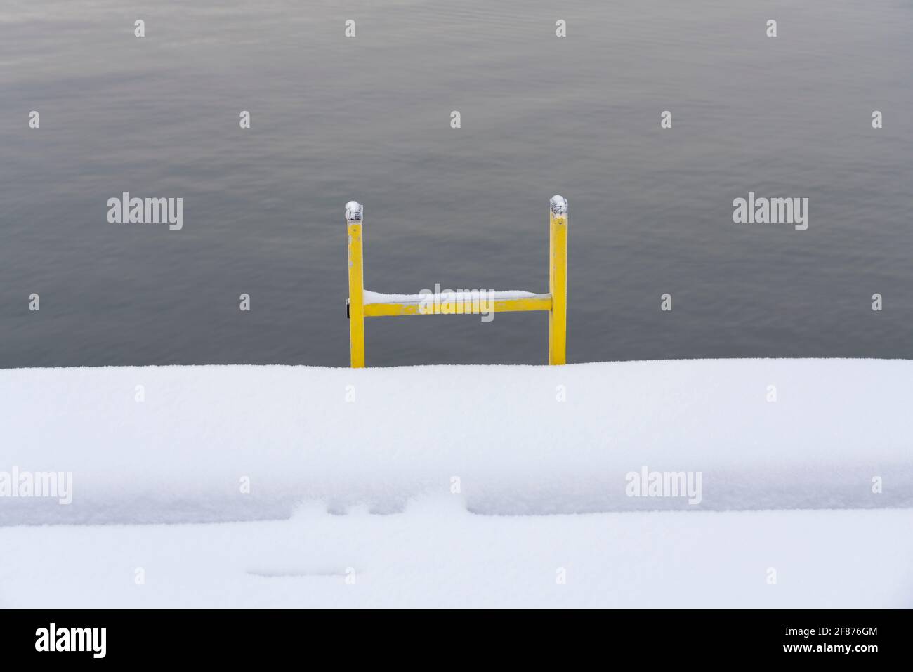Yellow ladder on the dock Stock Photo