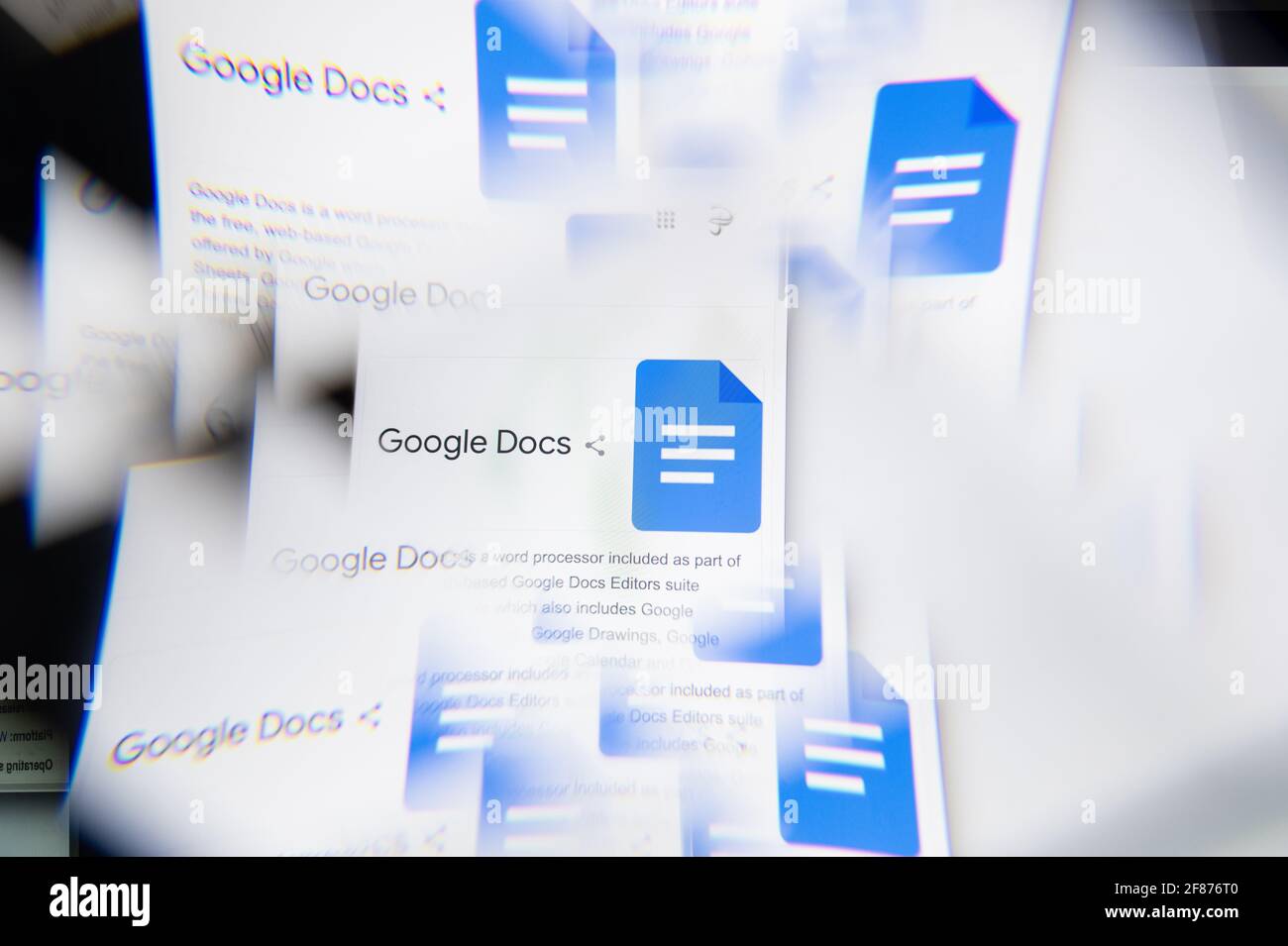 Milan, Italy - APRIL 10, 2021: Google Docs logo on laptop screen seen through an optical prism. Illustrative editorial image from Google Docs website. Stock Photo