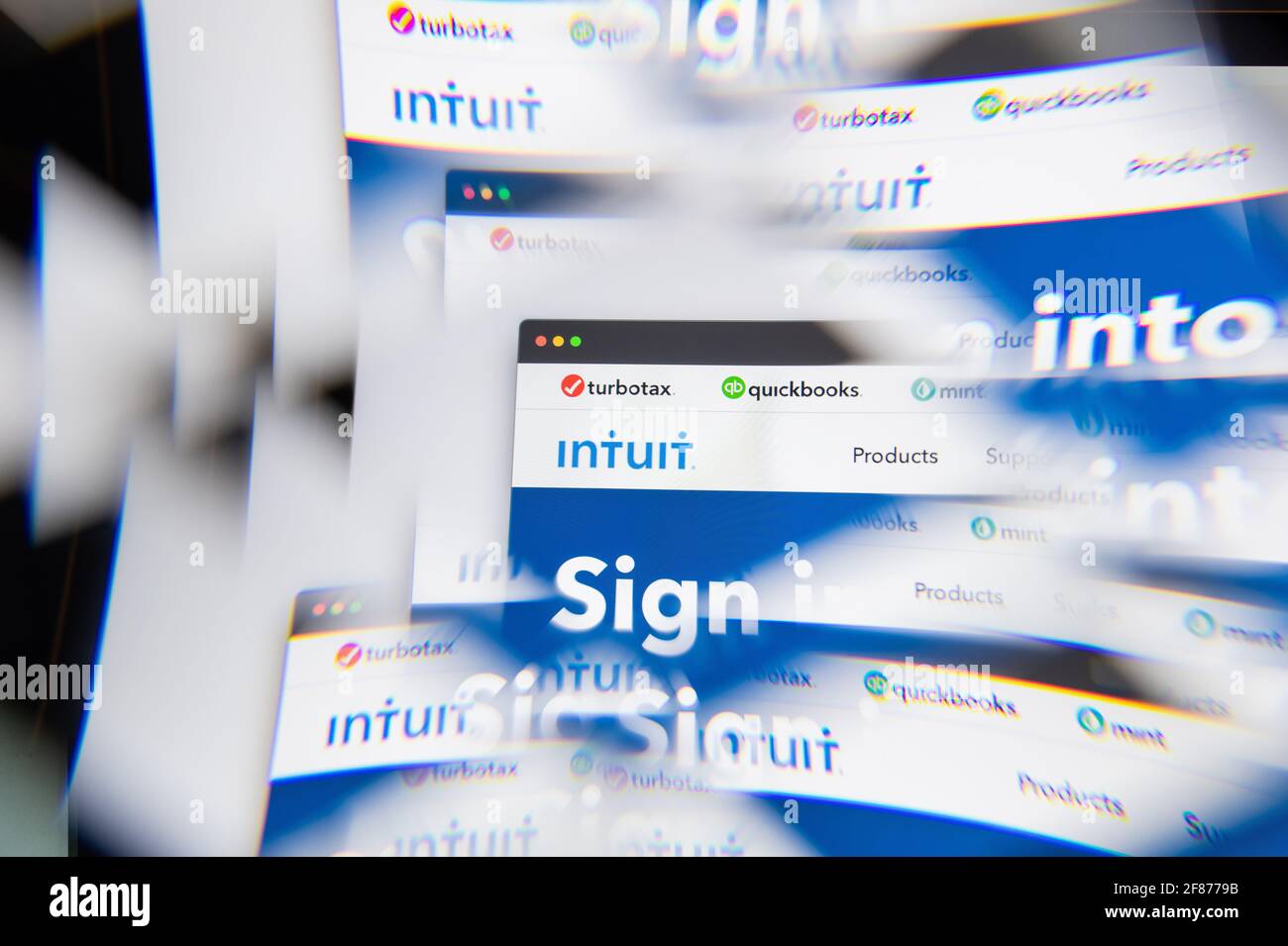 Milan, Italy - APRIL 10, 2021: Intuit Quickbooks logo on laptop screen seen through an optical prism. Illustrative editorial image from Intuit Quickbo Stock Photo