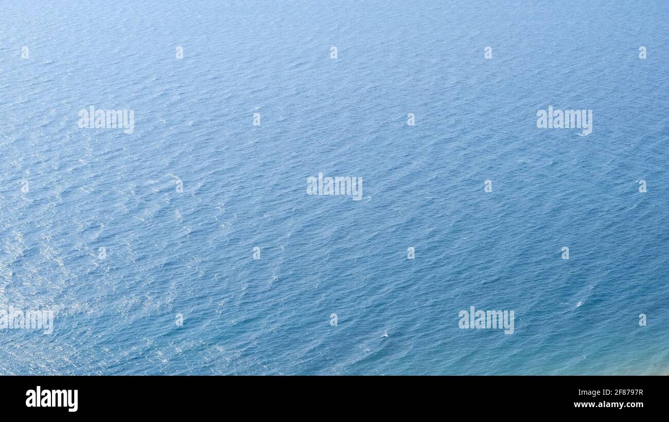 Ripples on the surface of blue sea water Stock Photo - Alamy