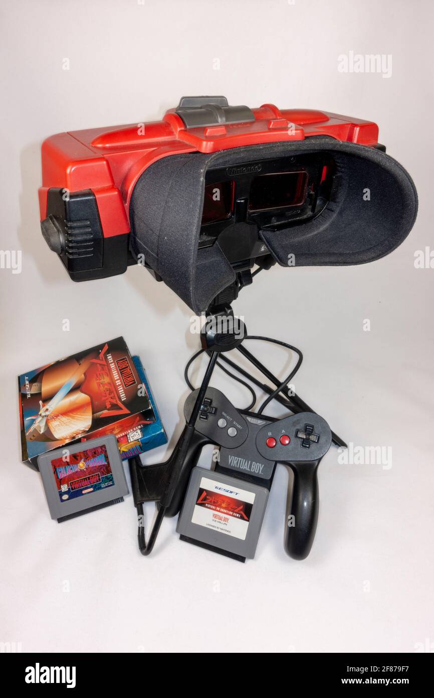 The Nintendo Virtual Boy table-top video game console with some game cartridges, first launched in Japan in 1995, (it did not launch in Europe). Stock Photo
