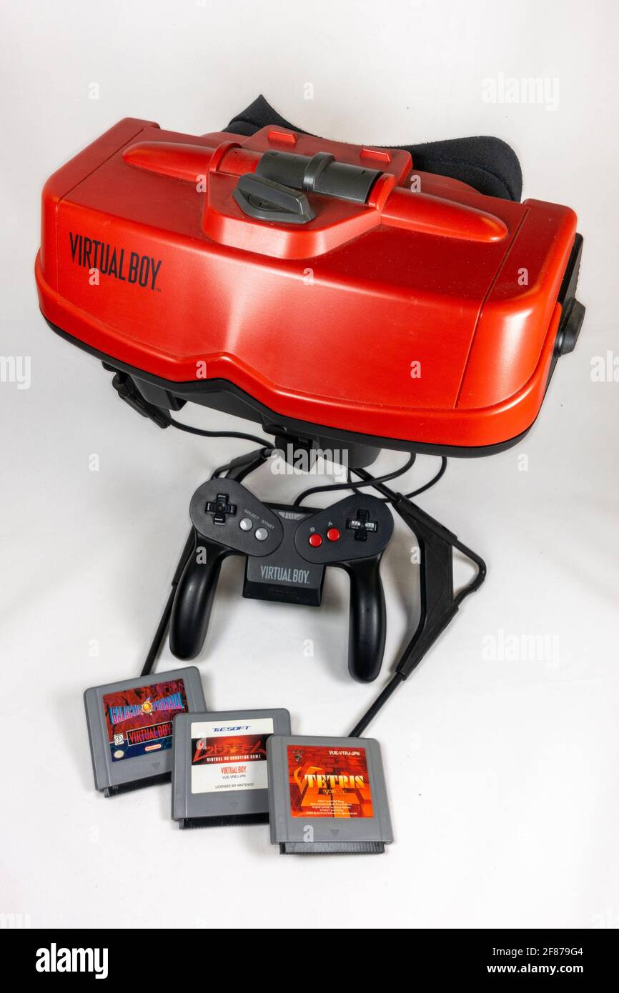 The Nintendo Virtual Boy table-top video game console with some game cartridges, first launched in Japan in 1995, (it did not launch in Europe). Stock Photo