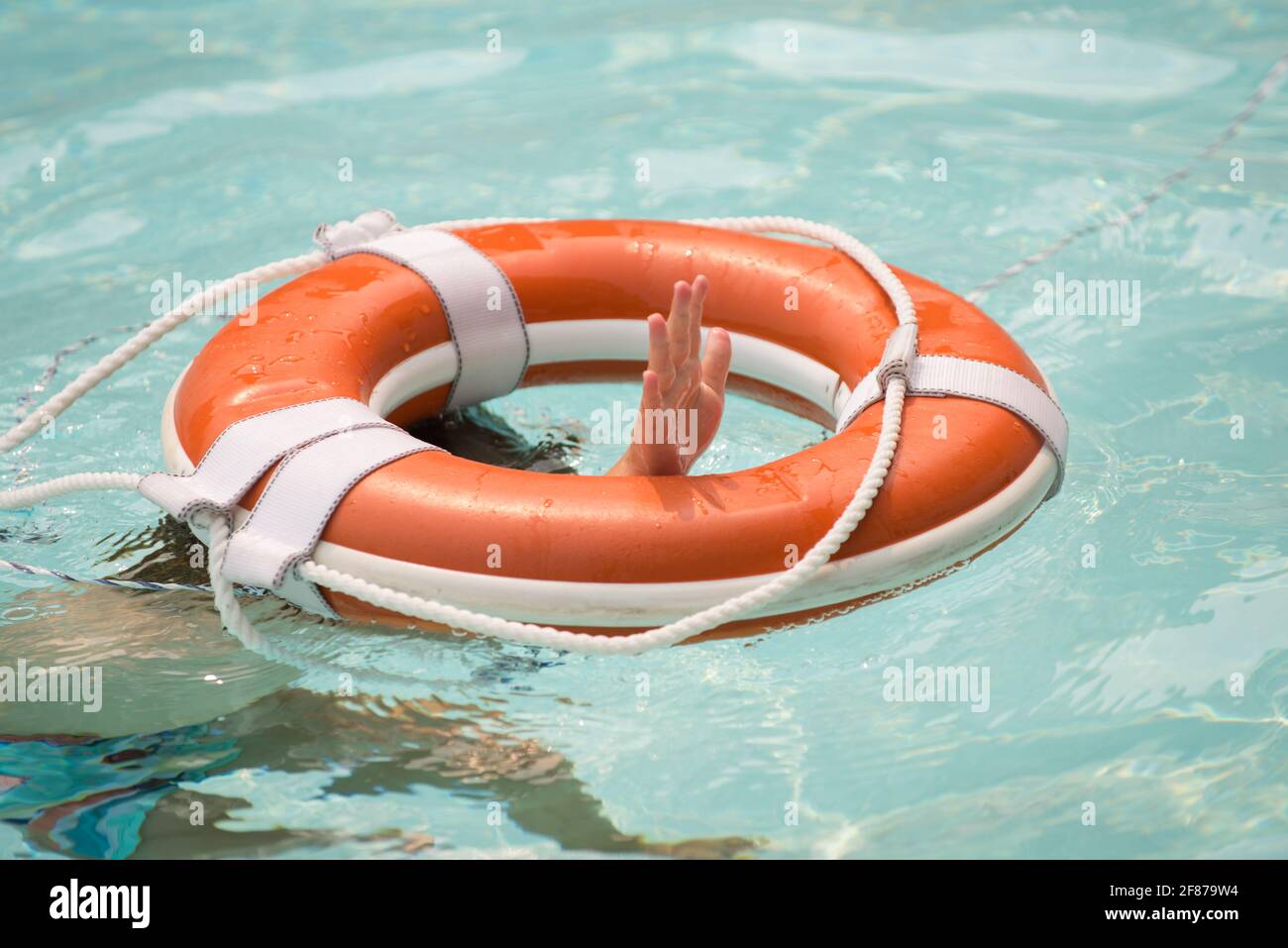 The concept of help, rescue, drowning, storm. Thrown life buoy saving  drowning person. Life buoy. Lifebuoy in water. Life ring floating in a sea,  life Stock Photo - Alamy