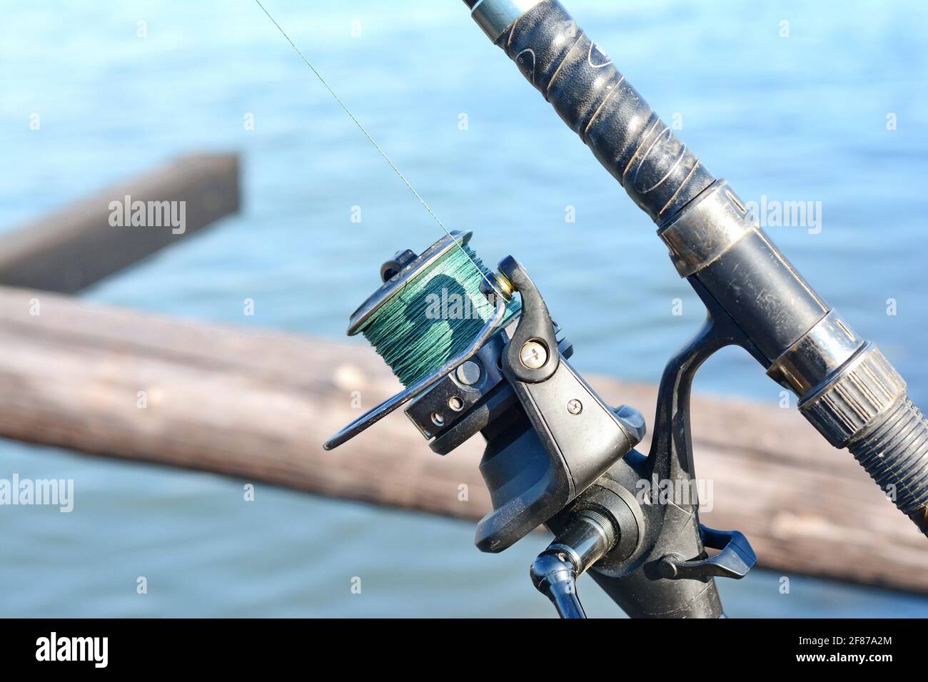 https://c8.alamy.com/comp/2F87A2M/ishing-reel-on-the-rod-fishing-on-the-feeder-carp-fishing-rods-with-carp-bite-indicators-and-reels-set-up-on-rod-pod-near-lake-river-2F87A2M.jpg
