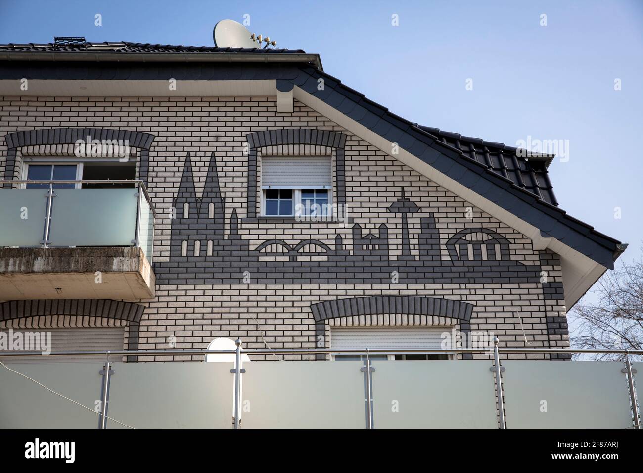 residential building in Suerth district with a clinkered panorama of Cologne on the facade, Cologne, Germany.  Wohnhaus im Stadtteil Suerth mit einem Stock Photo