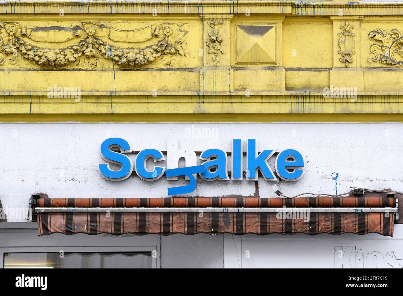In keeping with FC Schalke 04's impending relegation, dreariness in the Gelsenkirchen-Schalke district. Broken Schalke lettering above a kiosk. Stock Photo