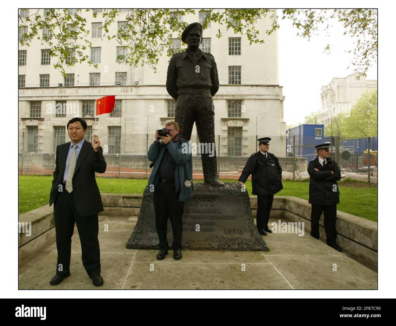 Pro and anti China Demo's outside Downing St for.........Tony Blair meets the Premier of the State Council of the Peoples Republic of China, H.E. Mr Wen Jiabao in the courtyard of the Foriegn Office to inspect the guard of Honour, The Queens co First Batalion Grenadier Guards.pic David Sandison 10/5/2004 Stock Photo