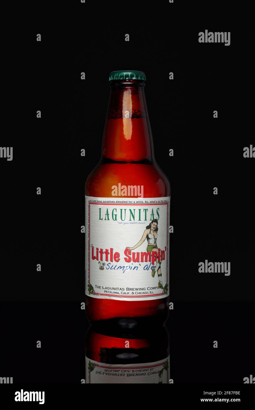 New York, USA - May 17 2020: Bottle of American Pale ale beer (Lagunitas Little Sumpin') isolated on black background. Stock Photo