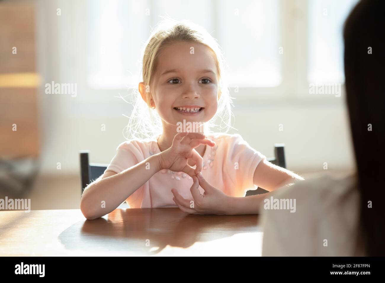 Little girl child learn sound pronunciation with teacher Stock Photo