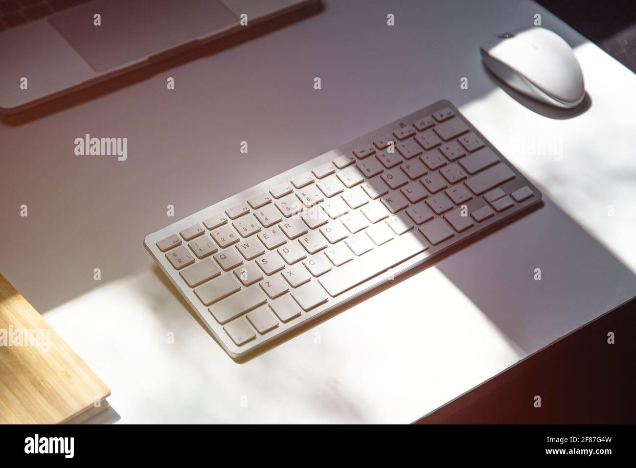 Office table with white keyboard and equipment for working. Stock Photo