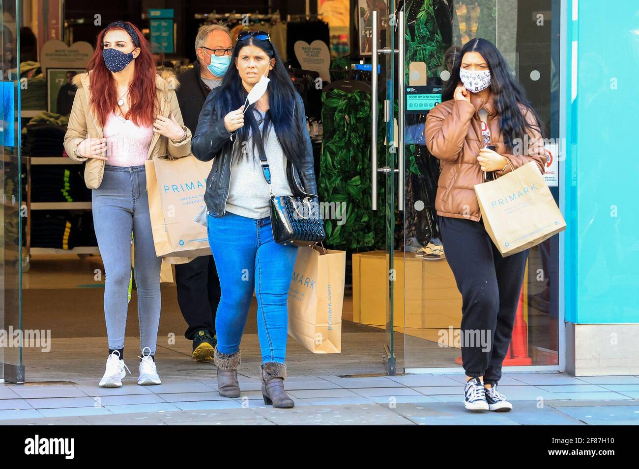 Newcastle Upon Tyne, UK. 12th Apr, 2021. Shoppers leave Primark in Northumberland Street, Newcastle upon Tyne, as retail premises are allowed to reopen to the public as national lockdown restrictions are eased in Newcastle upon Tyne, England on 4/12/2021. (Photo by Iam Burn/News Images/Sipa USA) Credit: Sipa USA/Alamy Live News Stock Photo
