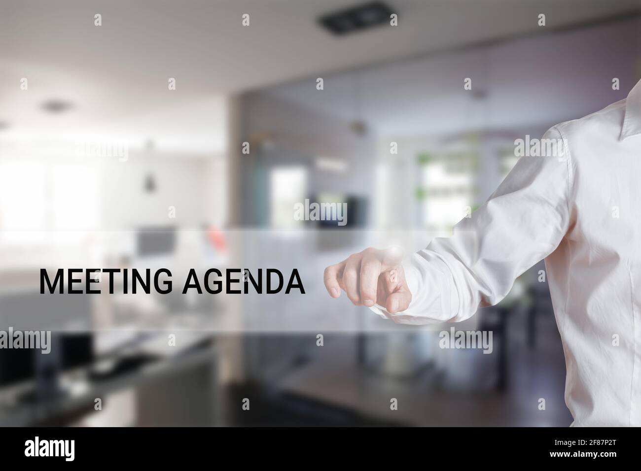 male-hand-pressing-the-word-meeting-agenda-on-a-virtual-search-display