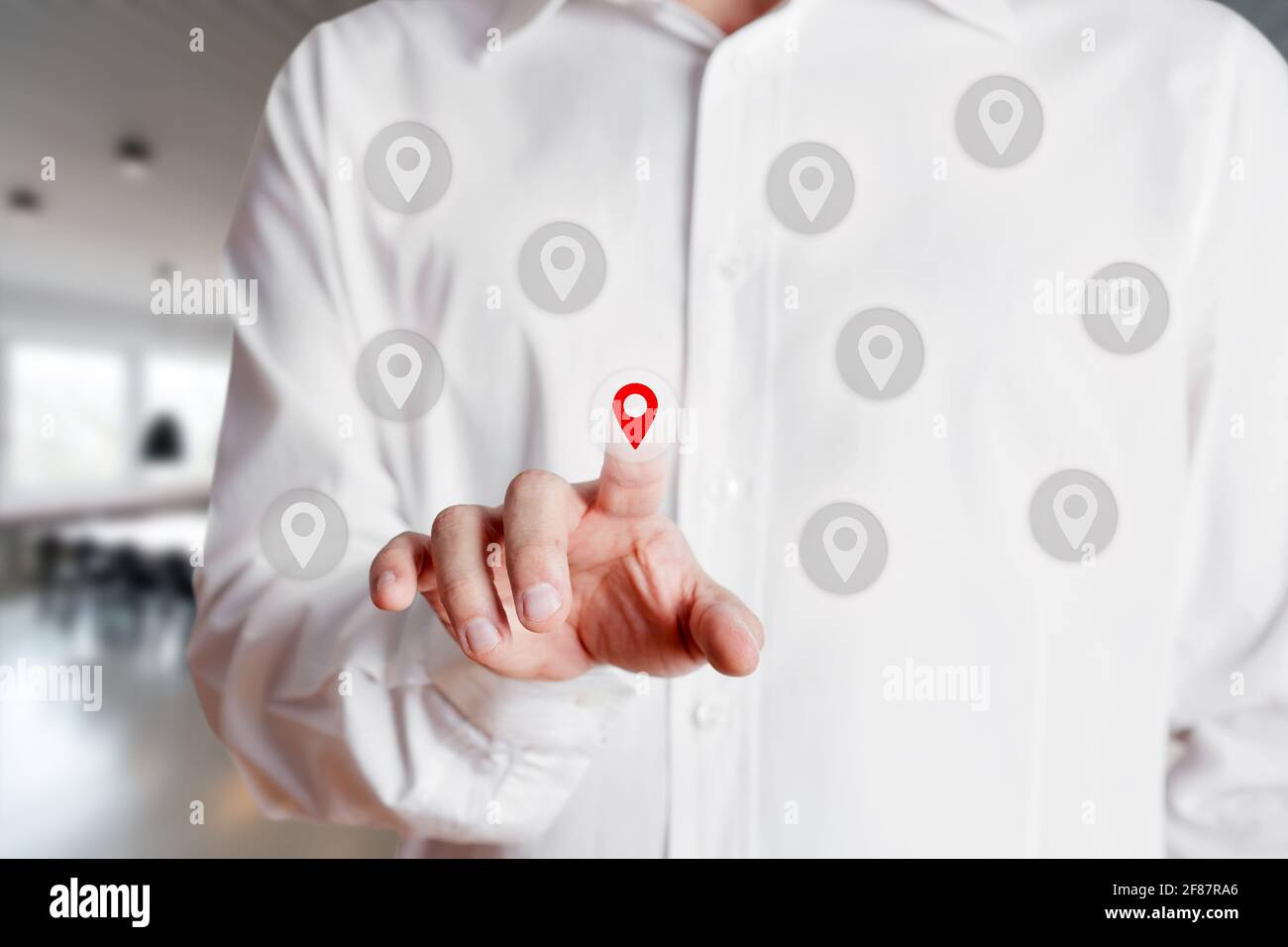 Businessman presses on and selects a location or map pin icon on virtual touch screen. Map pointer navigation concept Stock Photo
