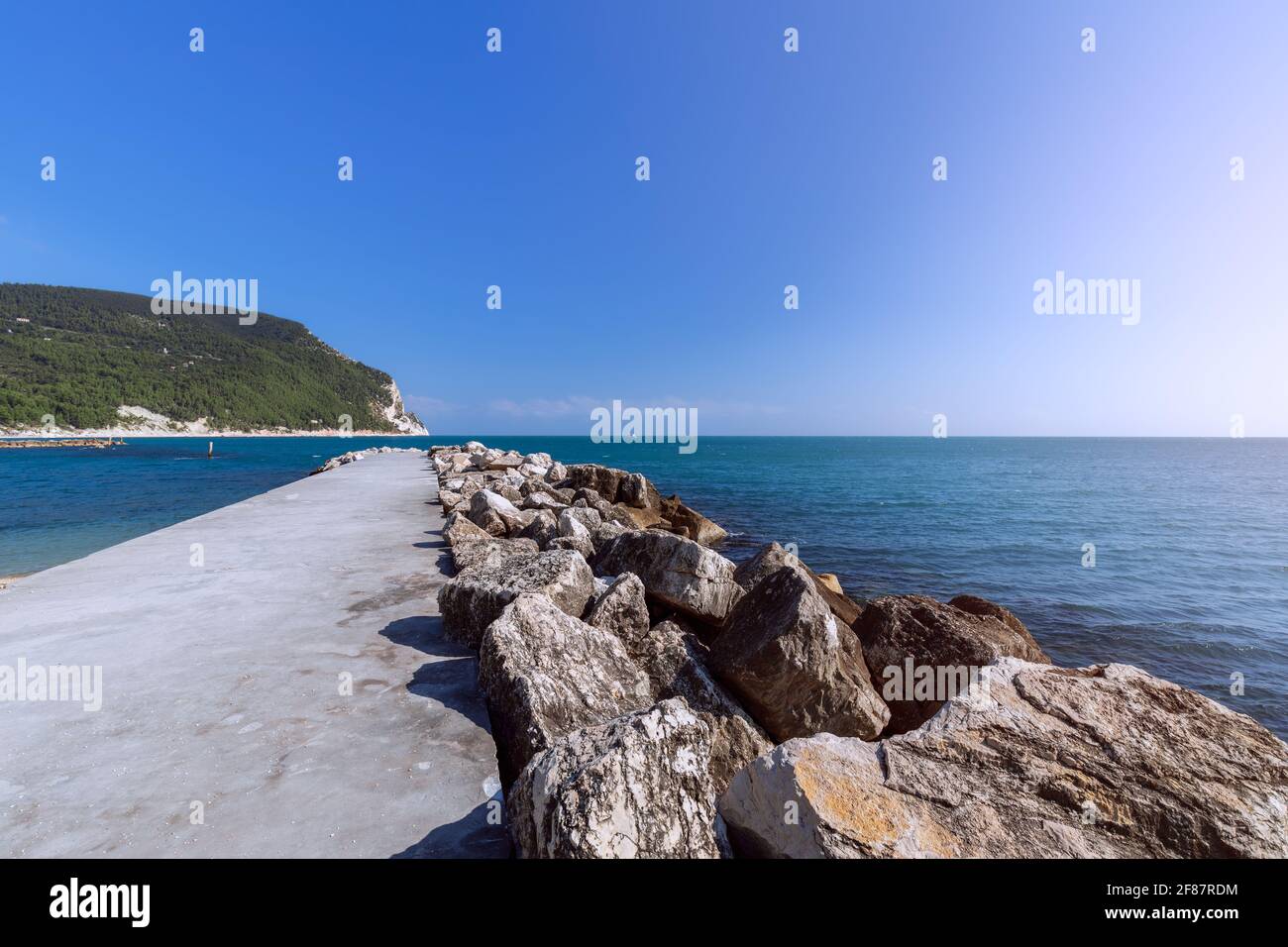 Marine pier on the beach Urbani in Sirolo, Ancona, Italy Stock Photo
