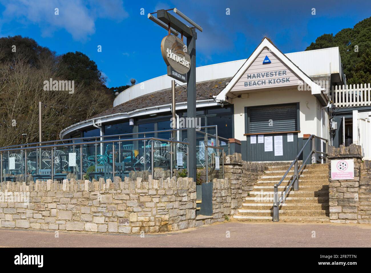Bournemouth, Dorset UK. 12th April 2021. Bournemouth attractions open on seafront with the easing of Covid-19 restrictions. Alfresco dining at the Harvester restaurant at Durley Chine seafront. Credit: Carolyn Jenkins/Alamy Live News Stock Photo