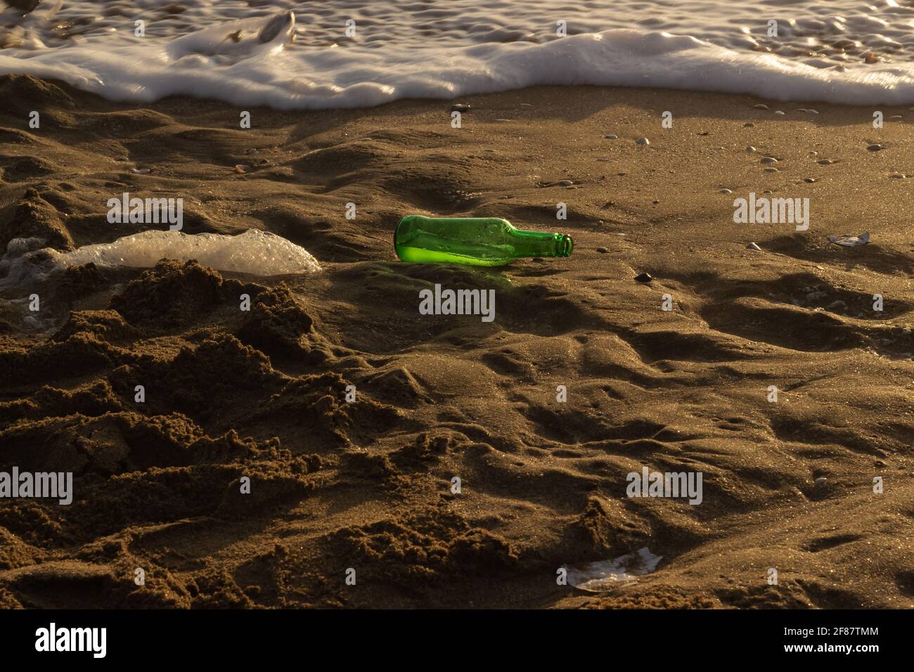 Glass bottle on the beach Stock Photo Alamy