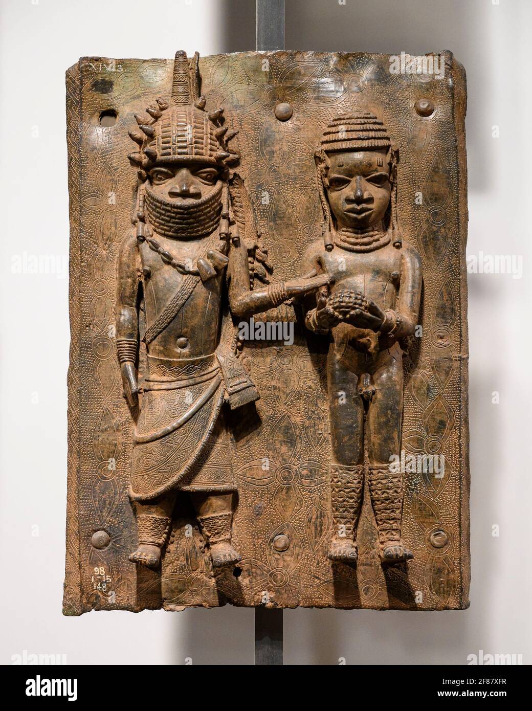 London. England. Benin Bronzes on display at the British Museum, brass plaques from the royal court palace of the Kingdom of Benin, 16-17th century. Stock Photo
