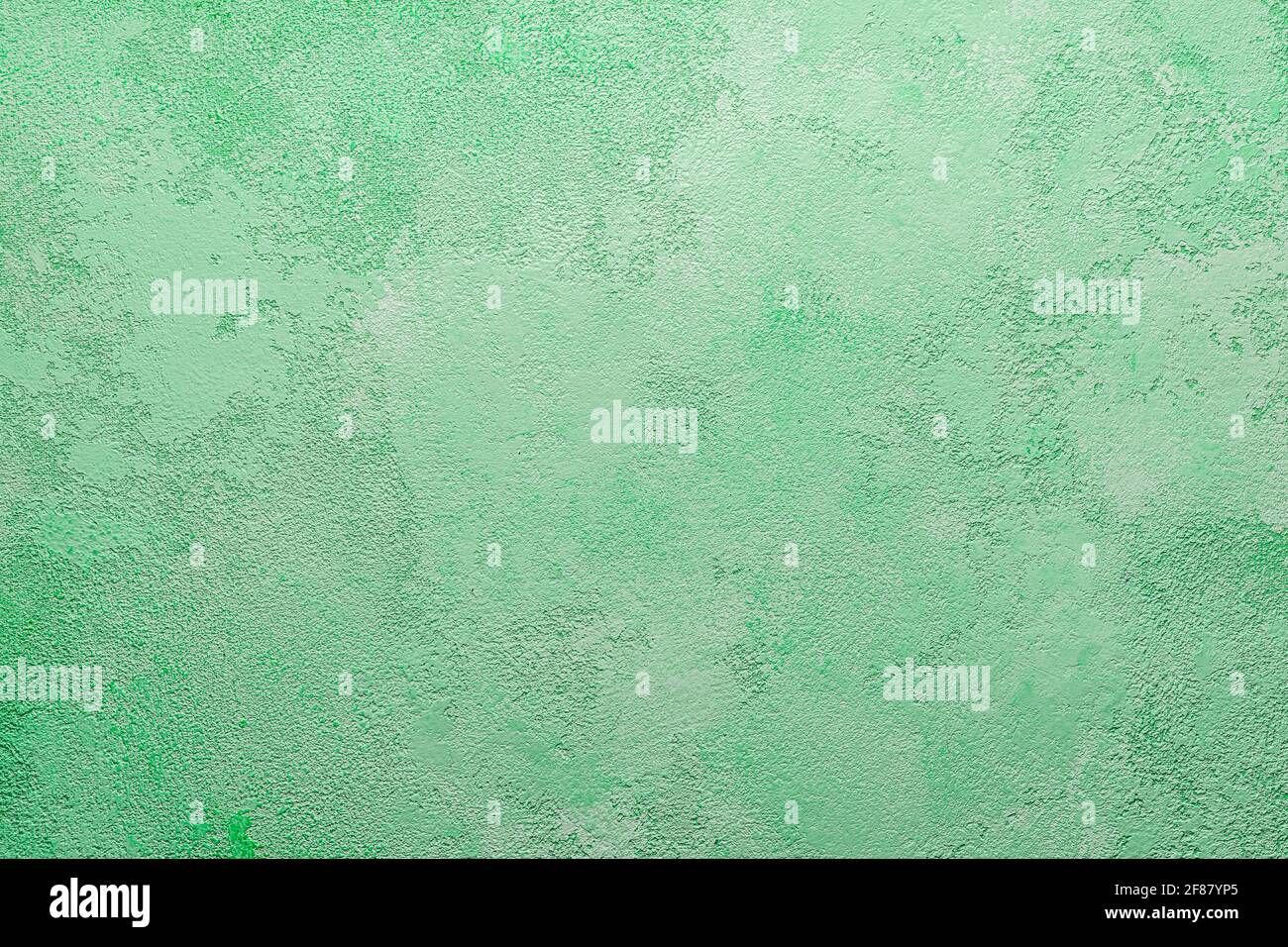 green concrete wall, plaster. Light green blank background. Stock Photo