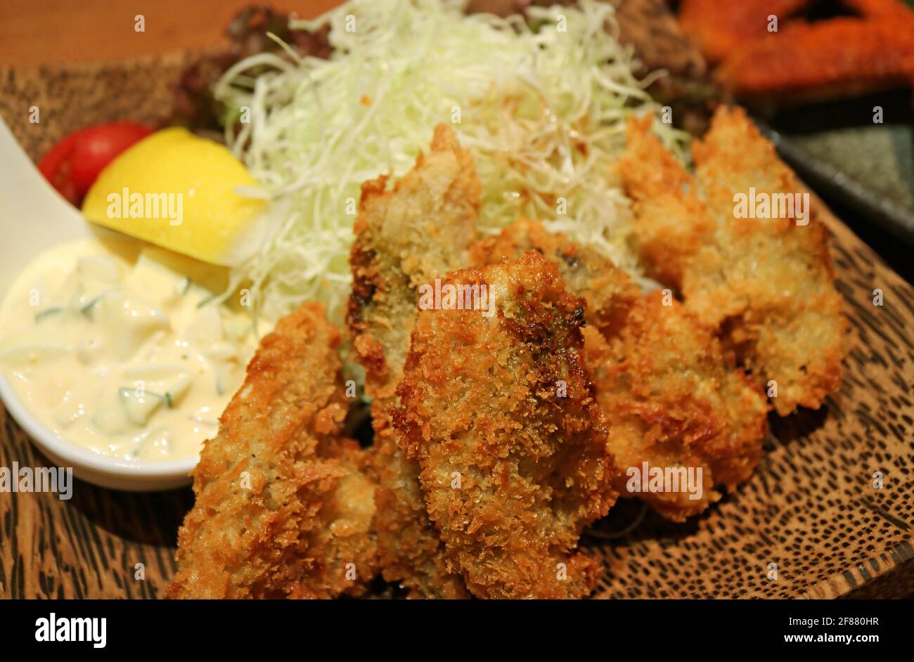 Closeup Japanese Dish of Deep Fried Oysters or Kaki Furai Topped with