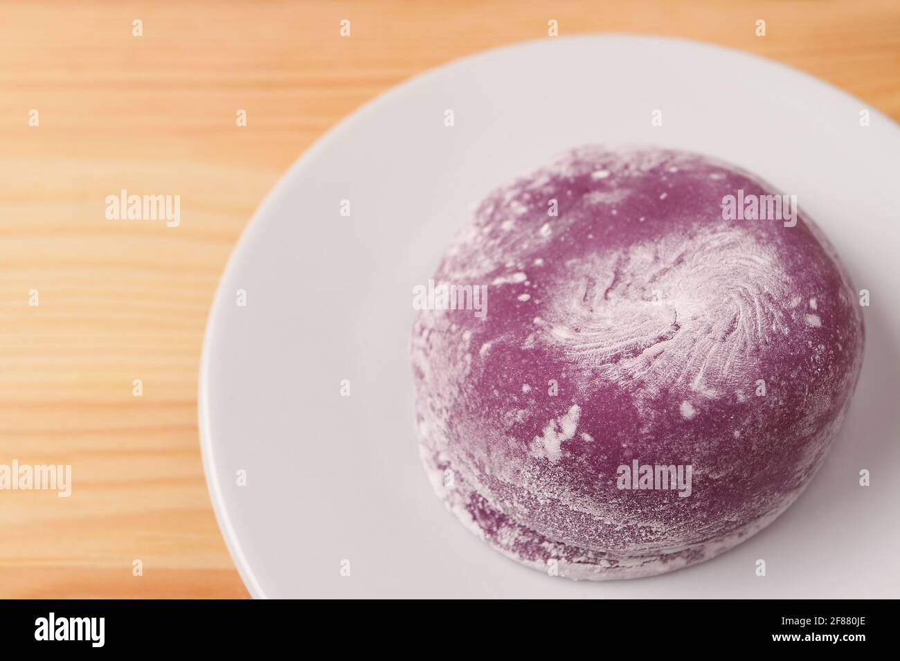 Closeup of Japanese Purple Sweet Potato Daifuku or Red Bean Paste