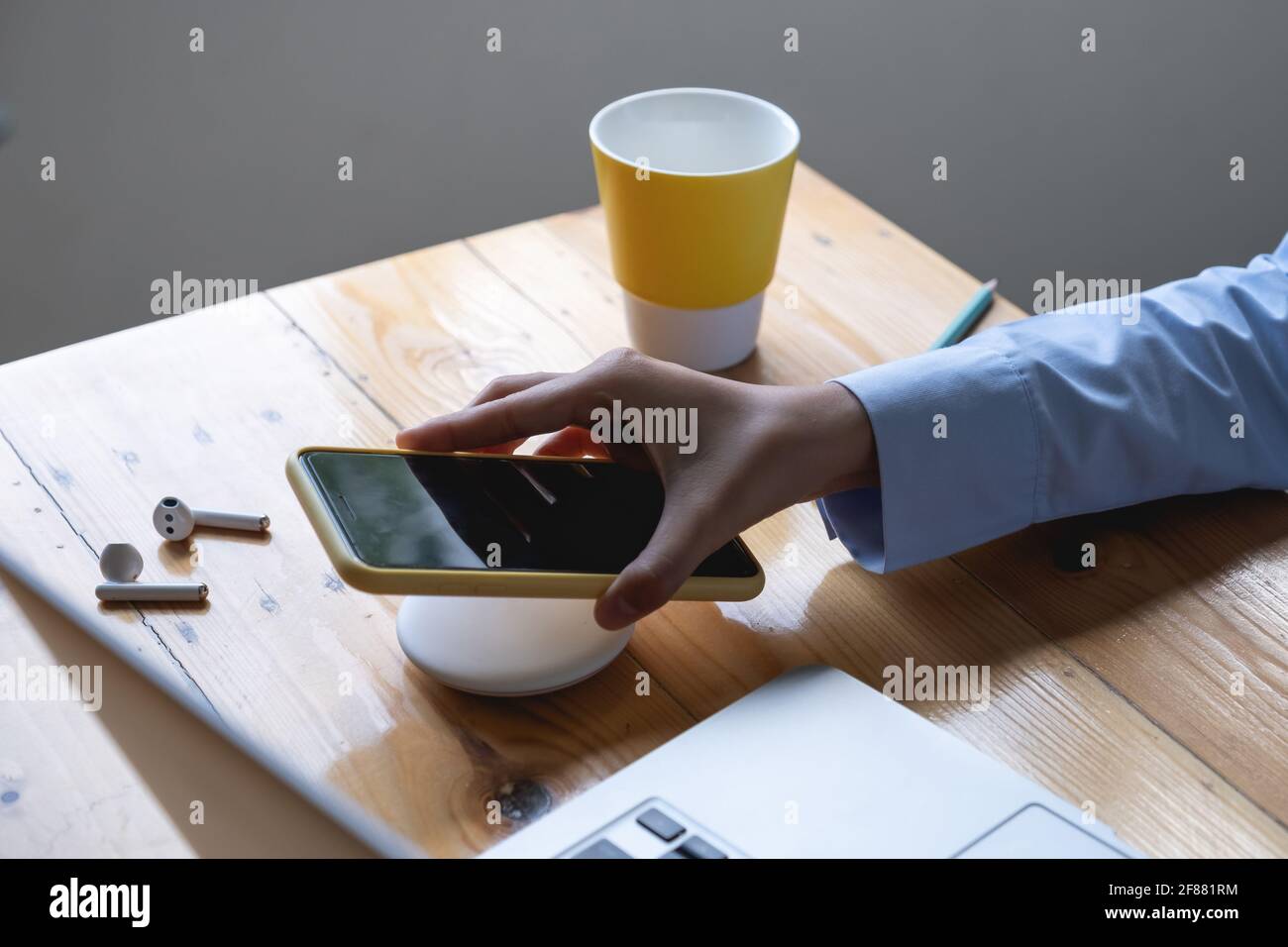 Woman using wireless charging . technology concept. Stock Photo