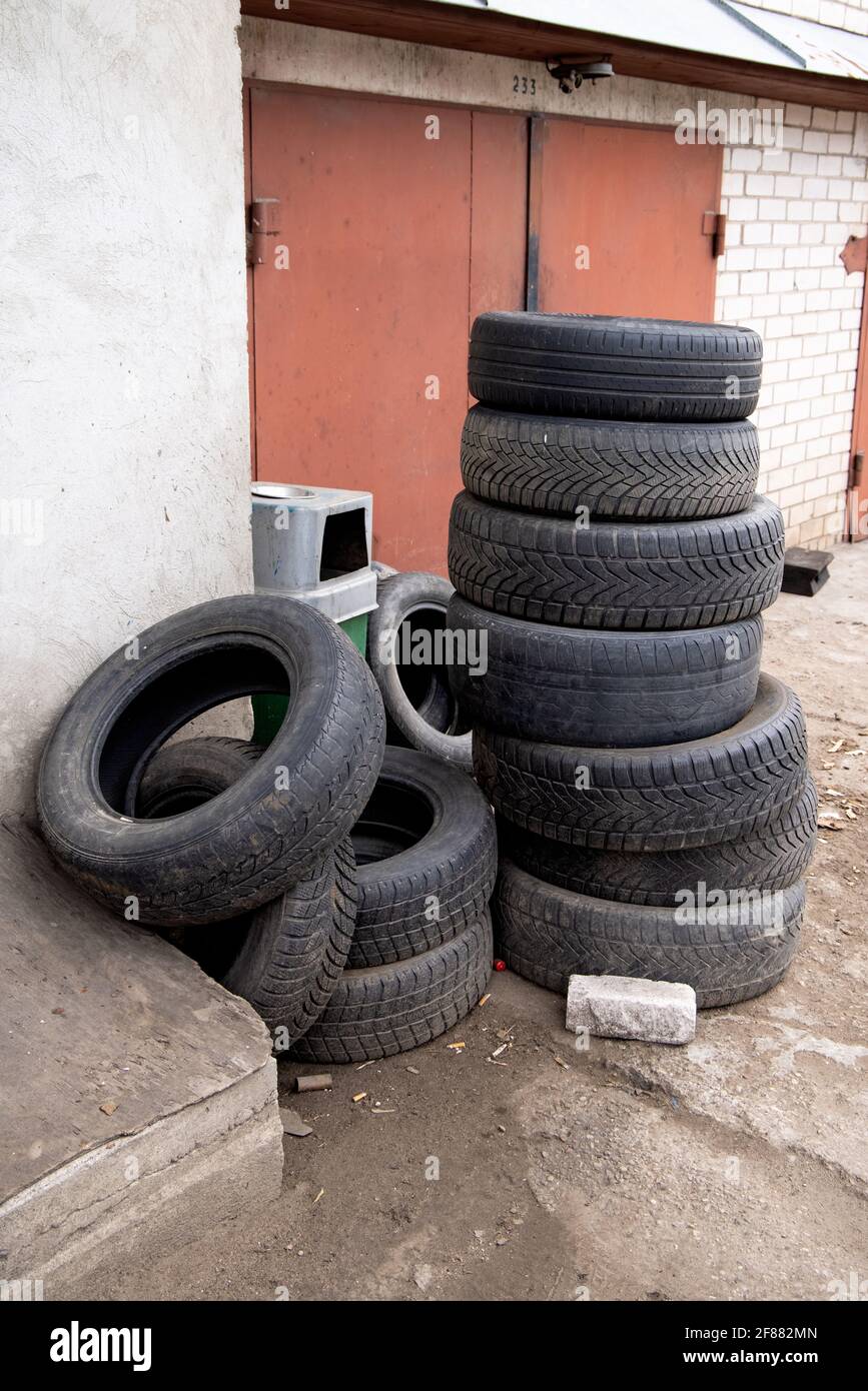 Wheel worn wear rubber tyre junkyard recycling heap hires stock
