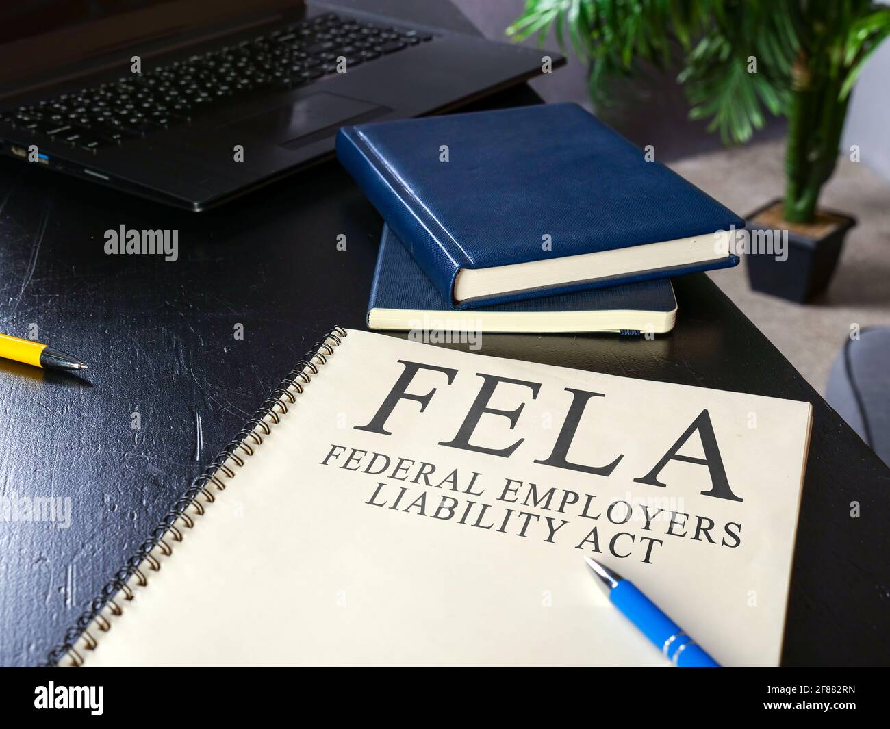 liability act FELA and pen on the surface. Stock Photo