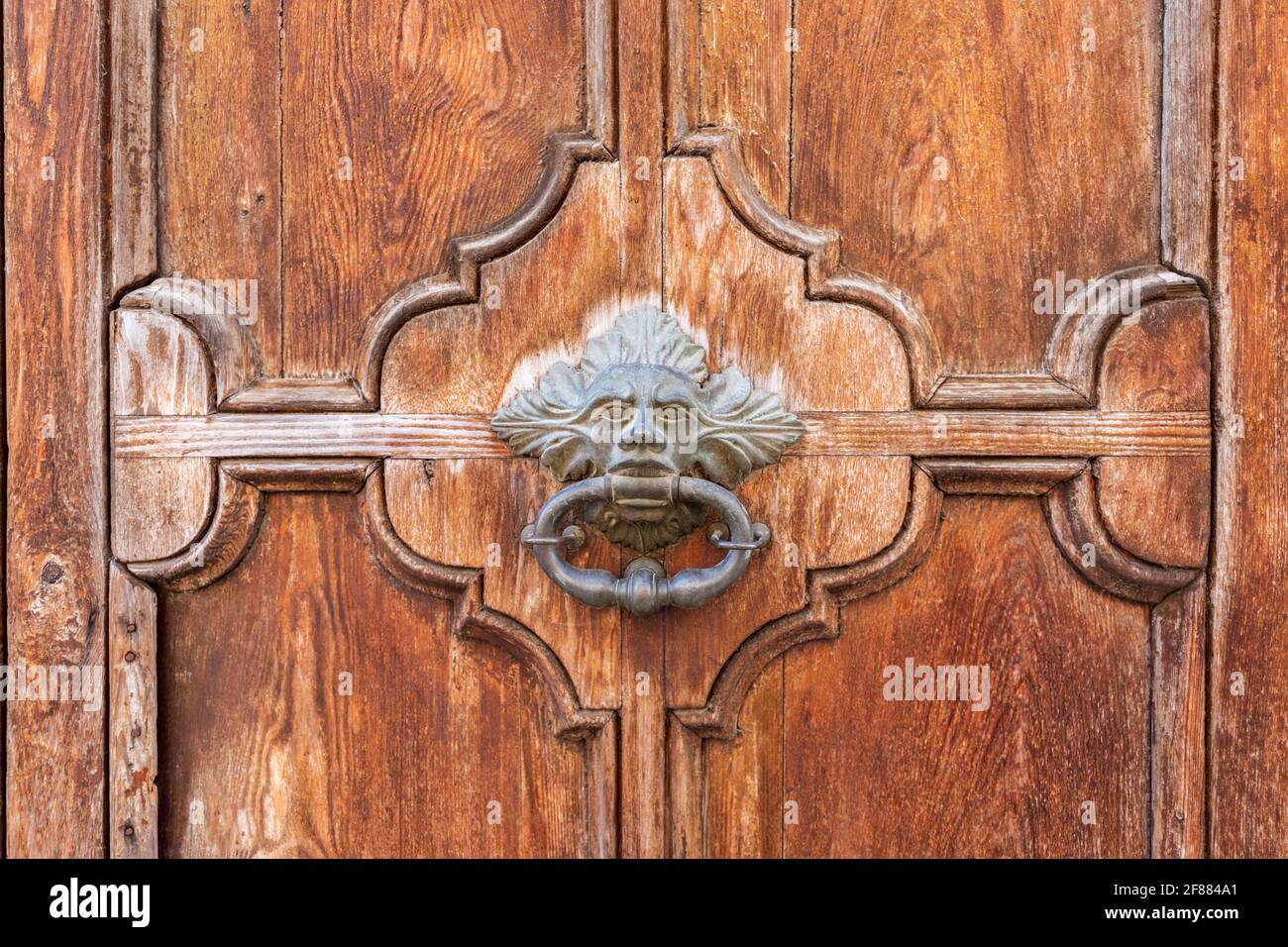Antique wooden door with handmade center handle Stock Photo Alamy