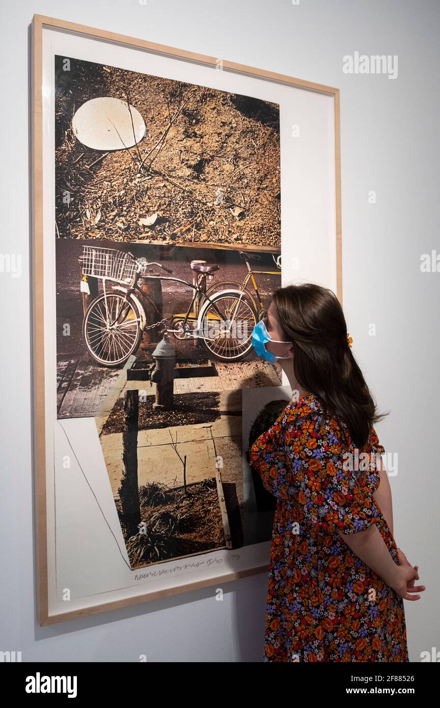 London, UK.  12 April 2021. A staff member poses with 'Street Sounds West', 1993, by Robert Rauschenberg at the delayed opening of Robert Rauschenberg’s “Metal, Ink and Dye: Late Works from Captiva Island” exhibition at BASTIAN gallery in Mayfair.  The UK government’s coronavirus roadmap out of lockdown has allowed art galleries to reopen today. The exhibition runs 13 April to 8 May 2021. Credit: Stephen Chung / Alamy Live News Stock Photo