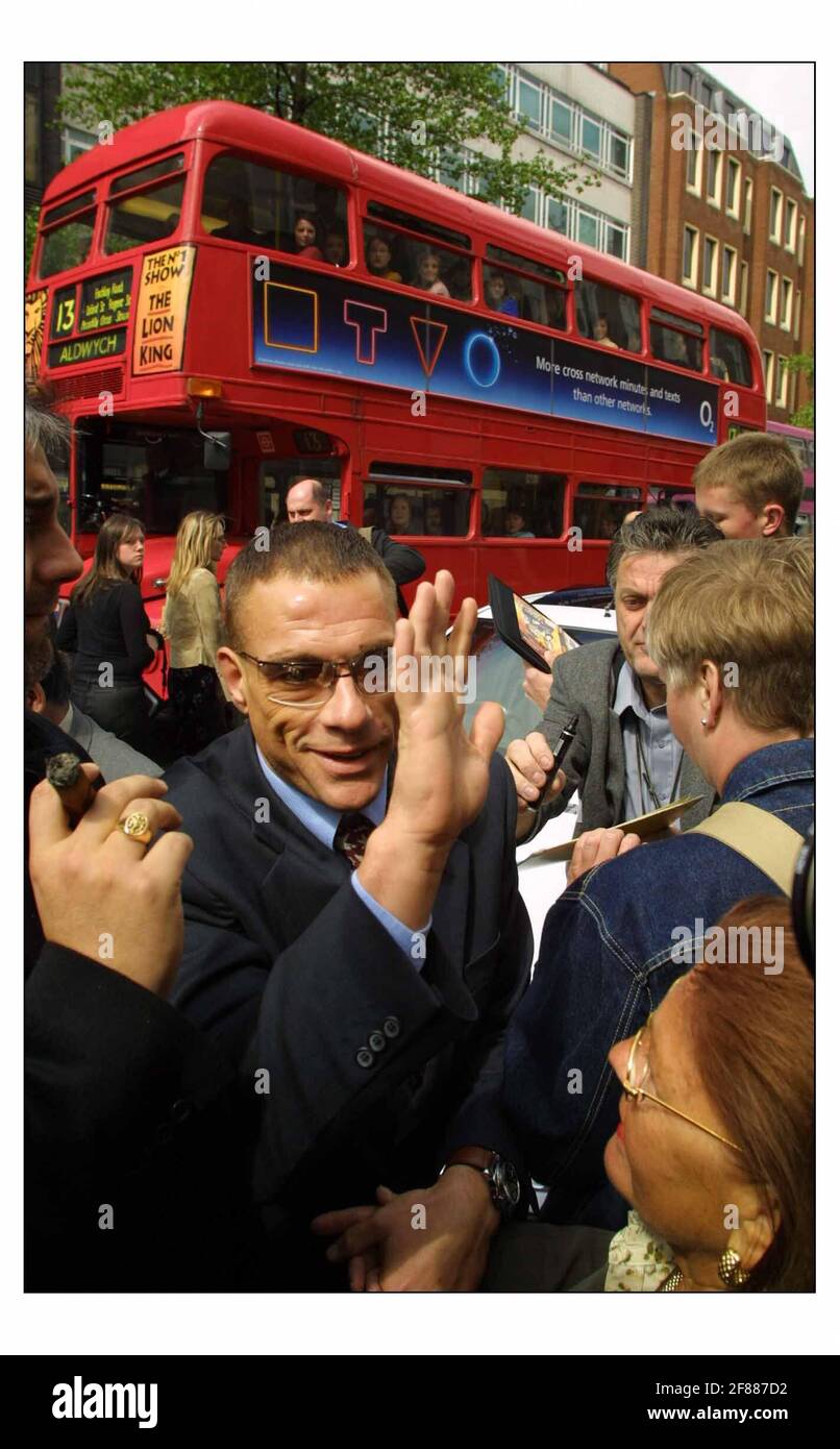 Film stars Jean Claude van Damme and Sir John Mills were on hand to unviel a Blue Plaque to honour John Lenon on the old Apple Records building in Baker street, London, where the Beatles famously played a rooftop gig.pic David Sandison 27/4/2003 Stock Photo