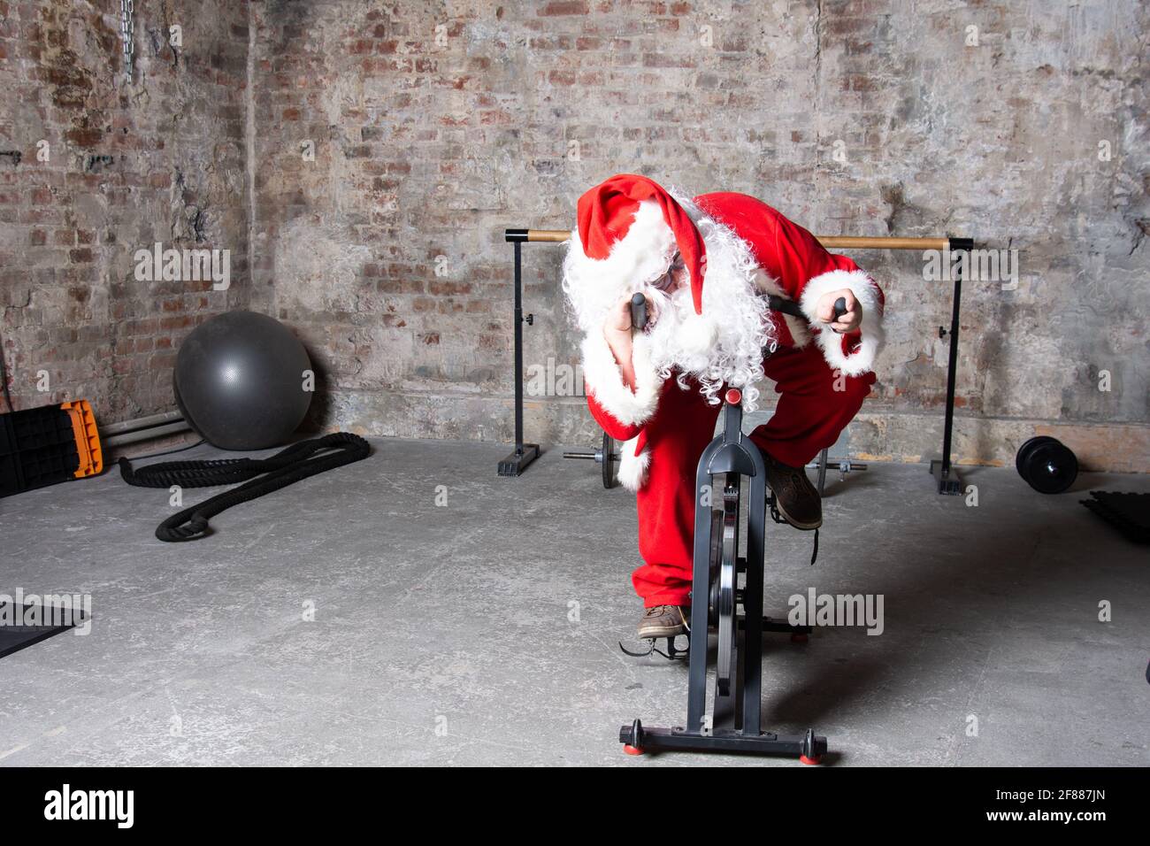 Fitness. Funny Santa Claus and gym Stock Photo - Alamy