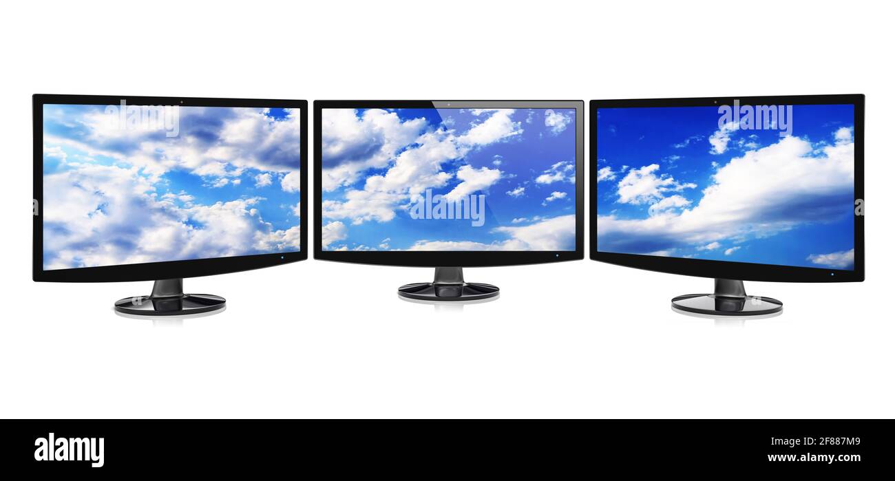 Computer wide monitors or TV in a panoramic set with a sky wallpaper on a screen. Isolated on a white. 3d image Stock Photo