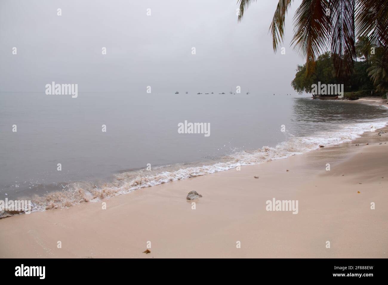 St. James, Barbados - April 10 2021: Thick ash from St. Vincent and the Grenadine's Soufriere volcano eruption turns sky and ocean grey in Barbados. Stock Photo