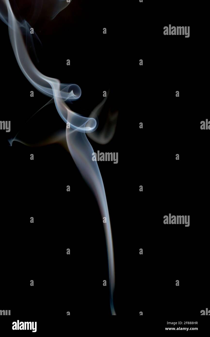 Wisp of smoke on a black background Stock Photo - Alamy