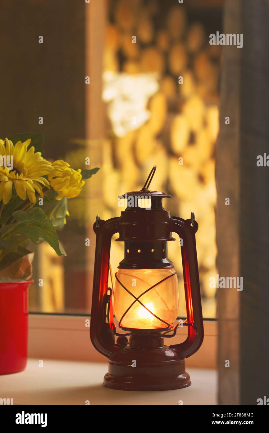 Kerosene lamp on the window. Old lamp Stock Photo