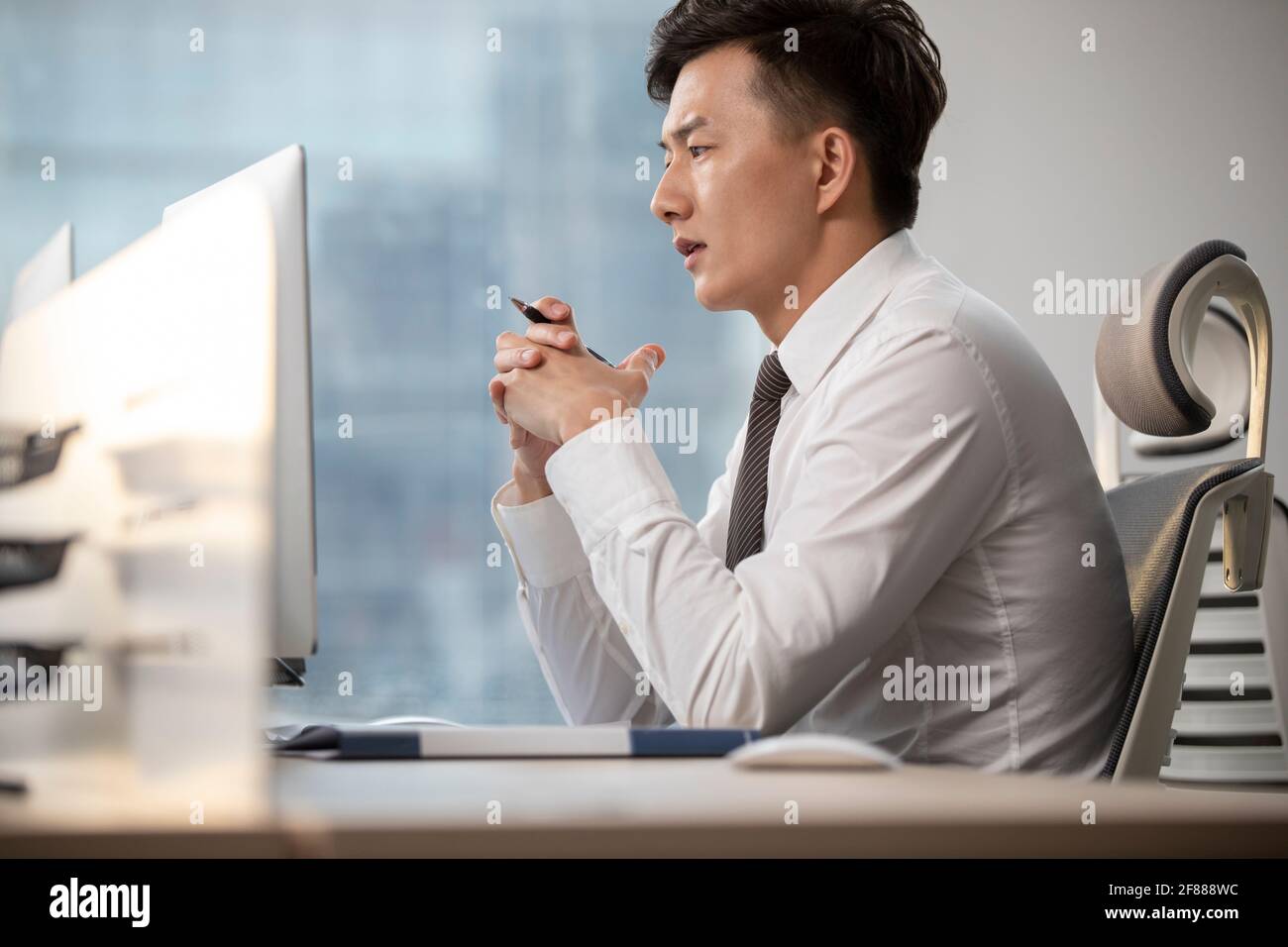 Young businessman working in office Stock Photo