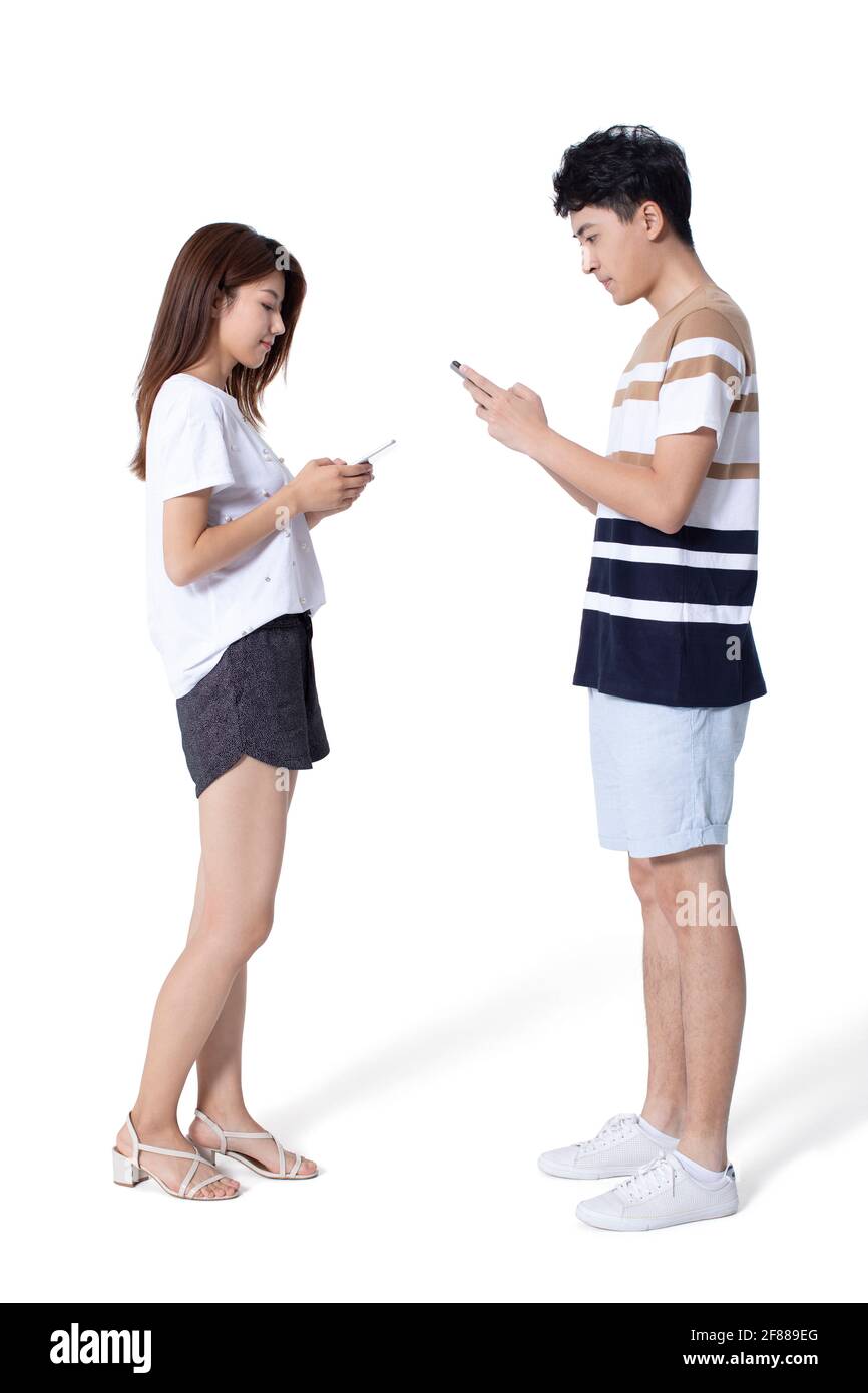 Young couple using smartphone Stock Photo