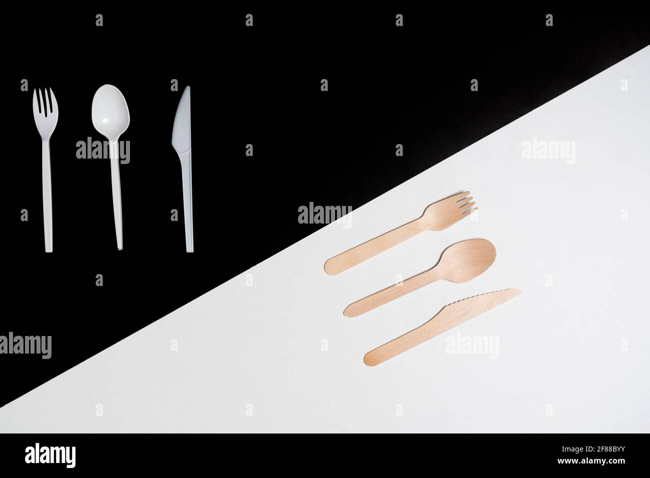 Dining utensils spoon, fork, knife, wooden vs plastic shown through the