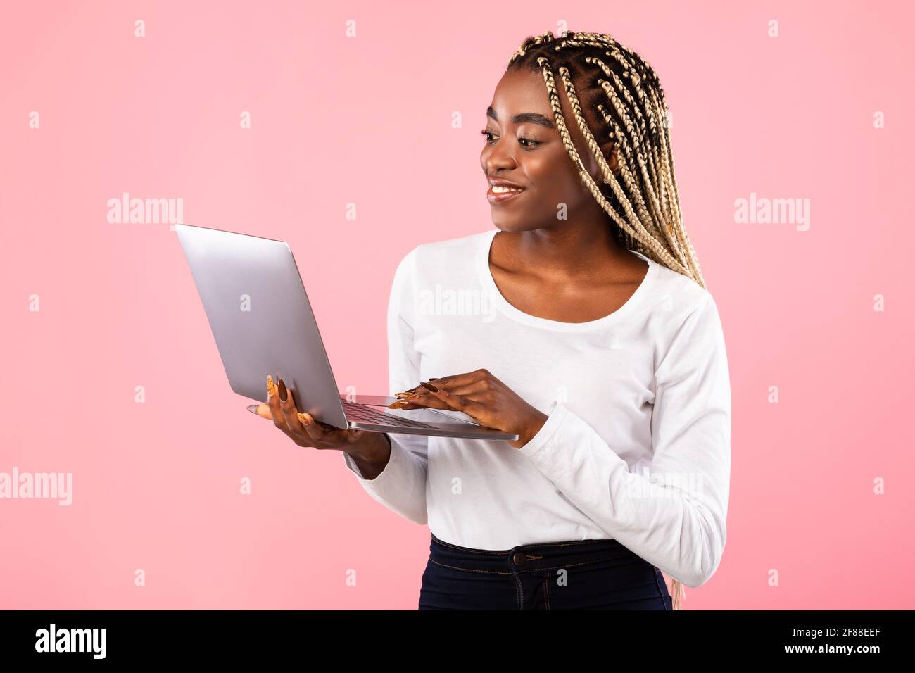 Young black lady using hi-res stock photography and images - Alamy