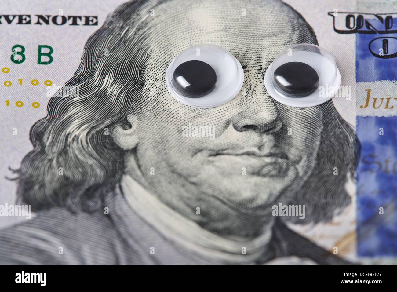 Large Googly Eyes on a Wood Desk Stock Photo - Image of view