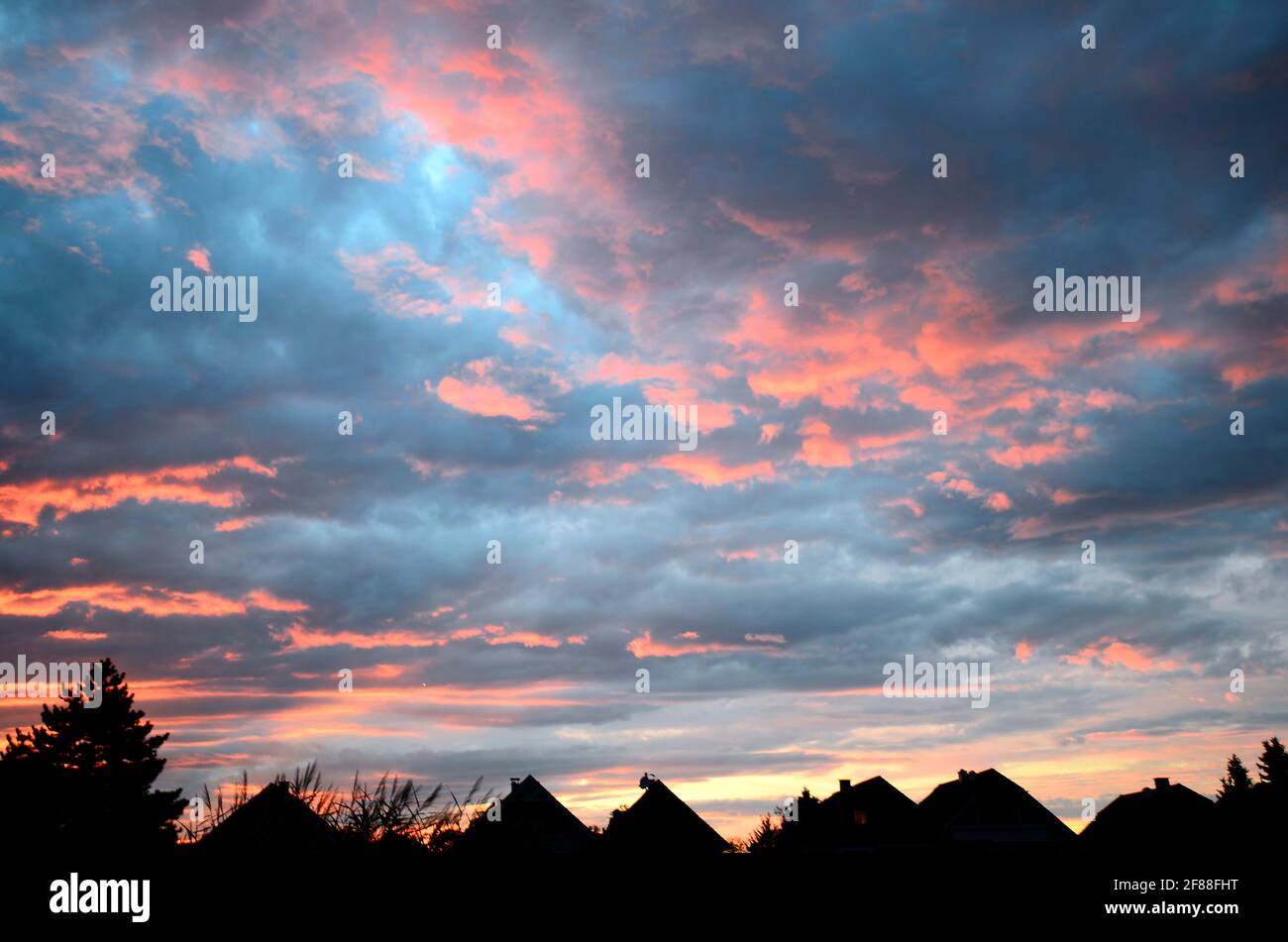 Austria, sunset glow over settlement in Lower Austria Stock Photo