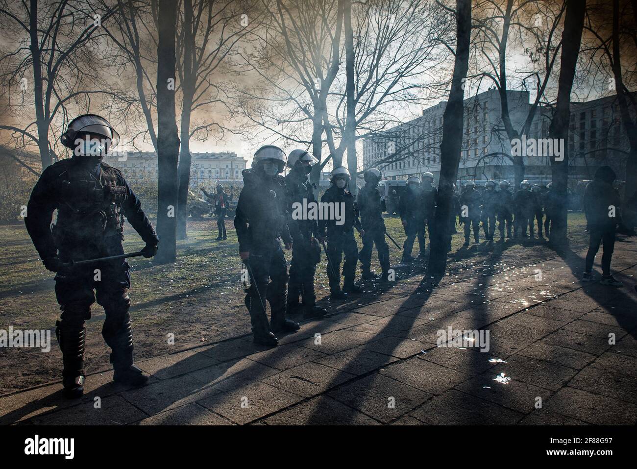 Warsaw, April 10, 2021:  Anti-riot policemen stand on guard  during the  11th anniversary celebration of the Smolensk plane crash and 81st anniversary Stock Photo