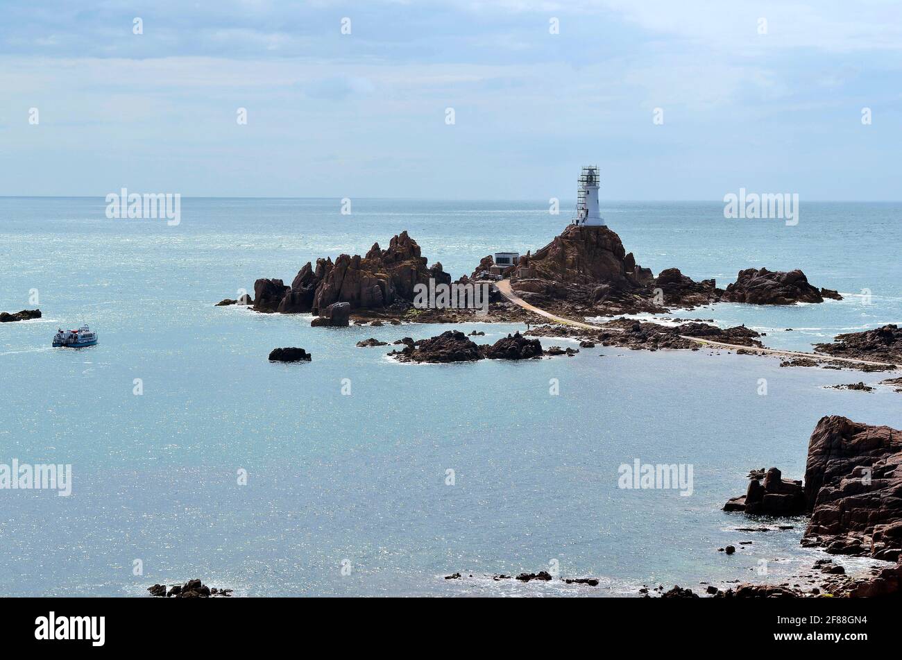 Jersey, La Corbiere lighthouse with causeway - accessible only by low tide  Stock Photo - Alamy