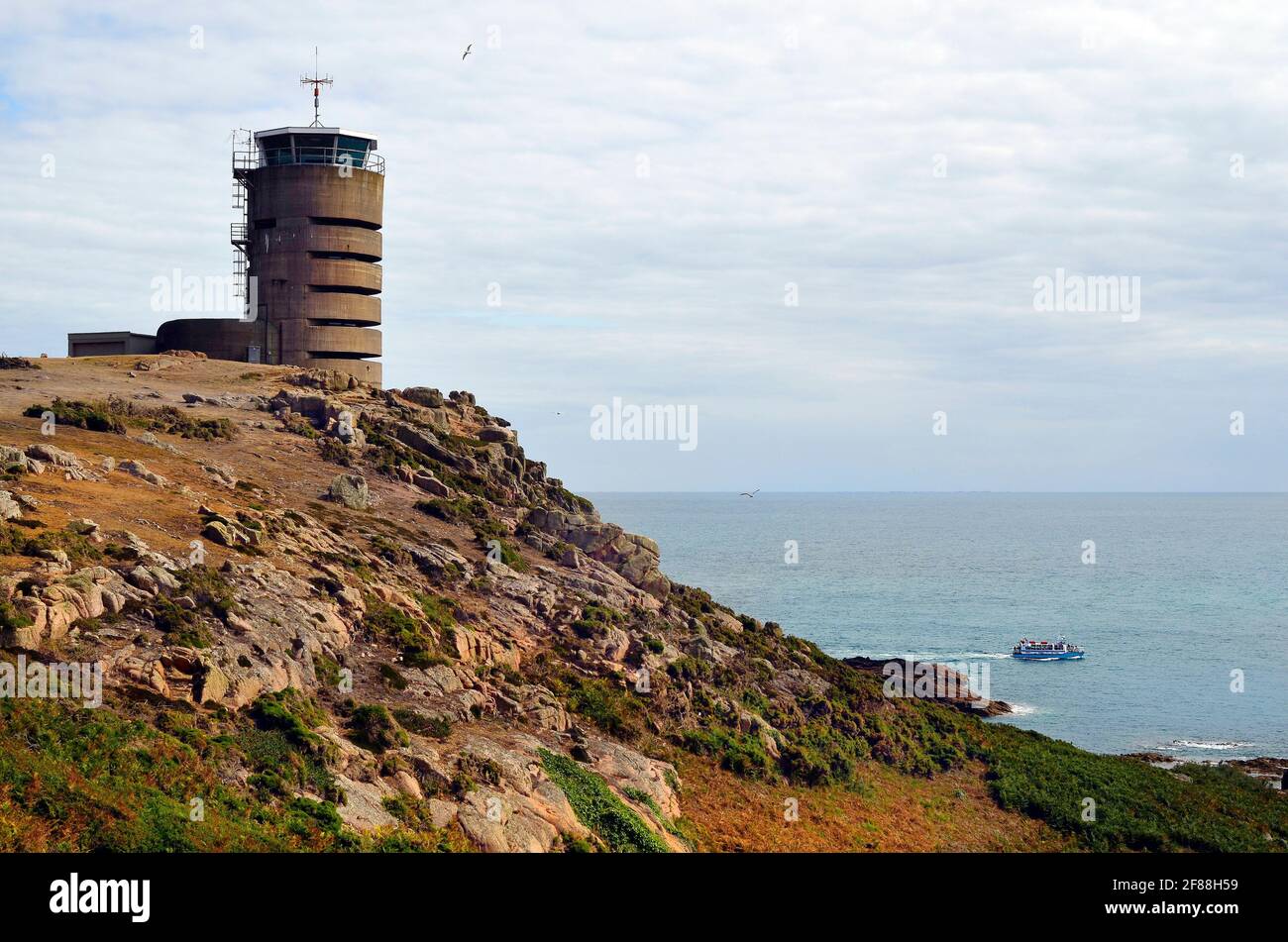 UK, Jersey, German WWII watchtower and bunker at La Corbiere now used as transmitting station Stock Photo