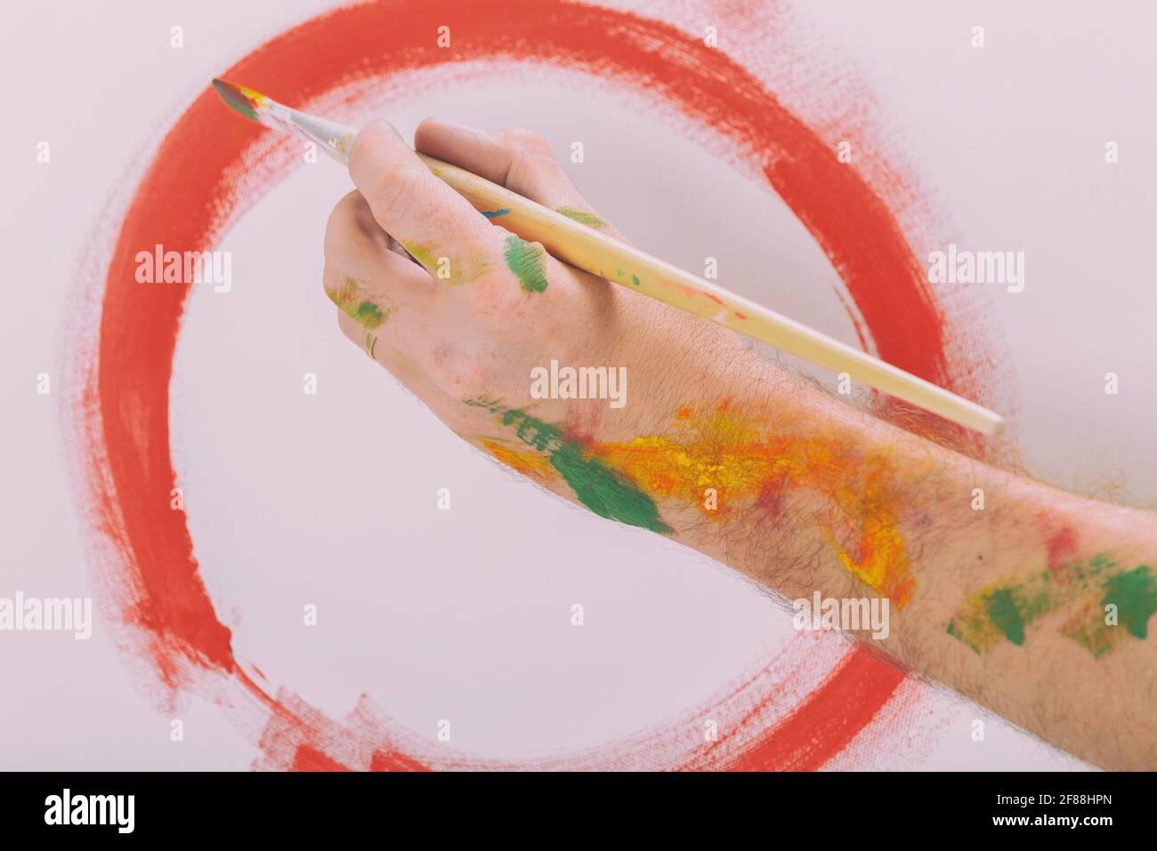 Hand holding paintbrush hi-res stock photography and images - Alamy