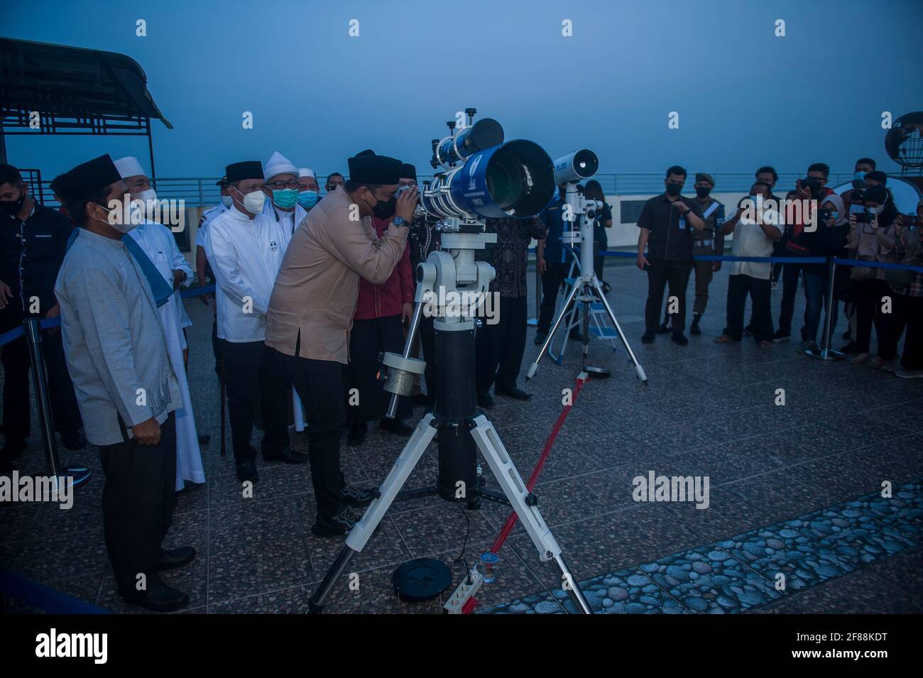 Medan, Indonesia. 12th Apr, 2021. Medan Mayor, Bobby Nasution and the Indonesian Ulema Council in Medan are participating in the process of monitoring the 'Hilal' or the time when the holy month of Ramadan is entered at the Observatory for Falak Science at the Muhammadiyah University of North Sumatra in Medan, Indonesia on April 12, 2021. The government announces that the majority of Indonesians are Muslims will perform fasting on April 13, 2021, which is in the holy month of Ramadan 1442 Hijriah. Photo by Sutanta Aditya/ABACAPRESS.COM Credit: Abaca Press/Alamy Live News Stock Photo