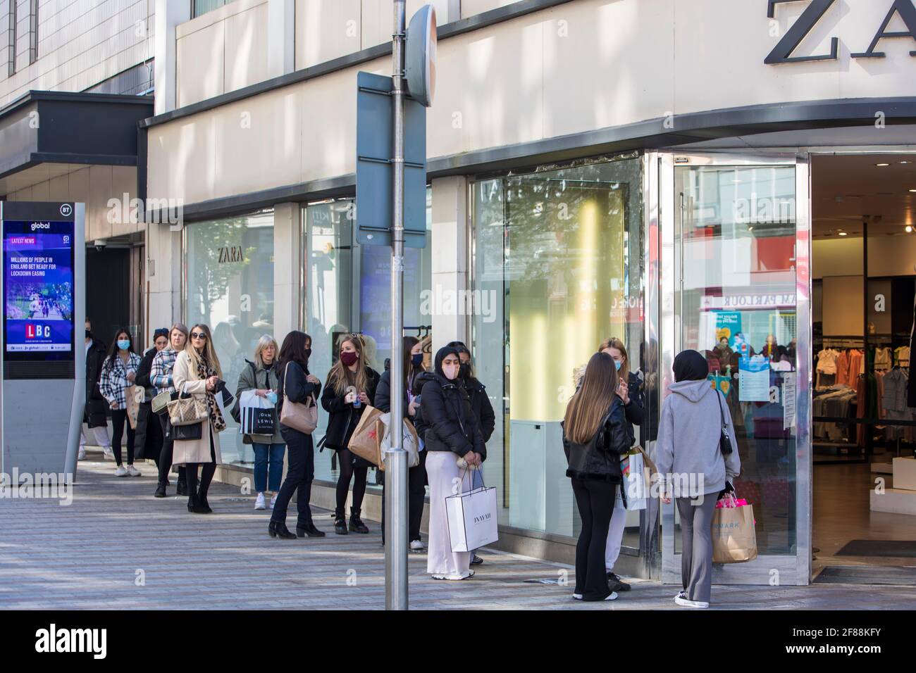 Leeds City Centre on the day that further. coronavirus. restrictions are  relaxed allowing all retails outlets to open. Hairdressers, gyms and  swimming pools. Shoppers queing outside Zara, Briggate, Leeds Stock Photo -